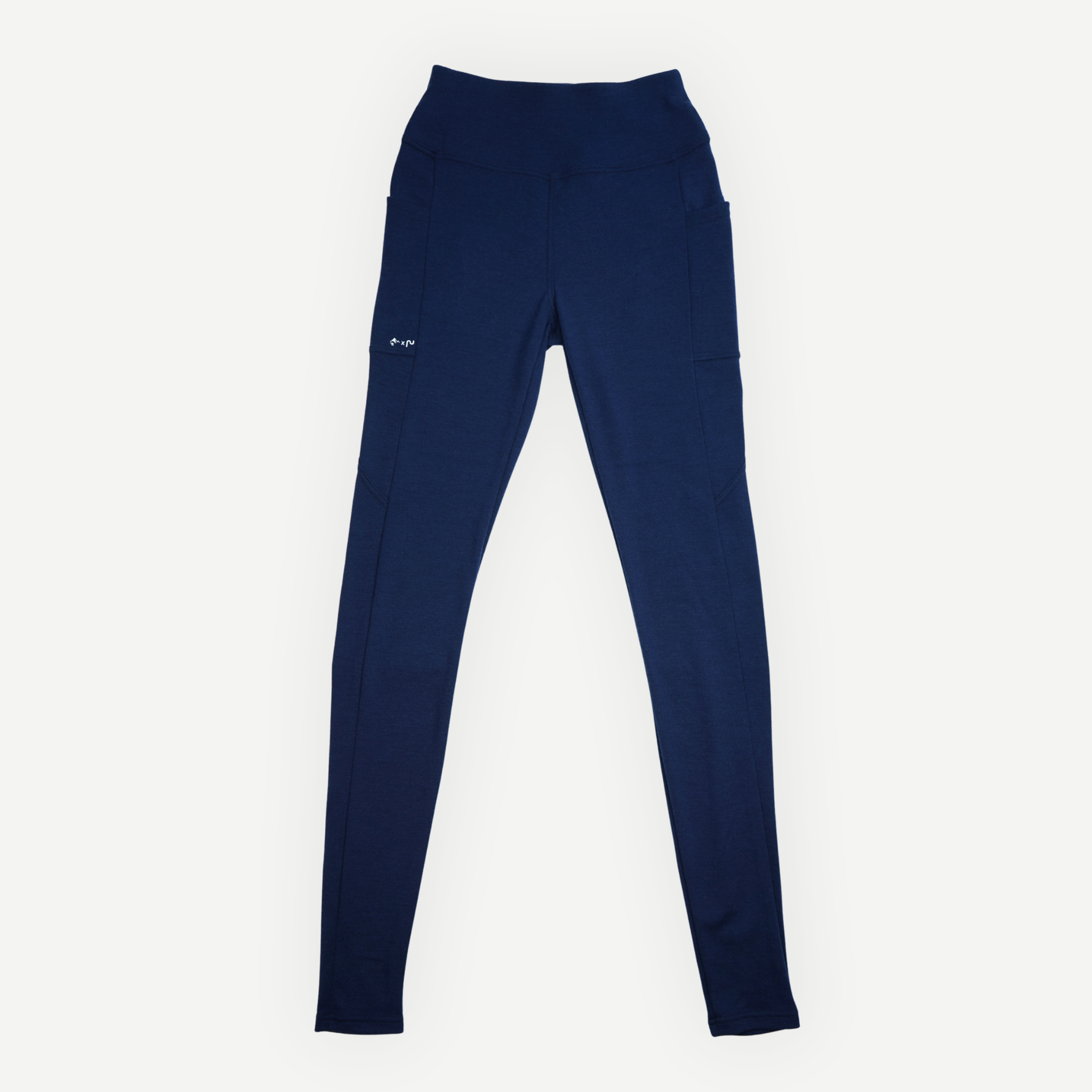 Vue avant du legging en laine mérinos Périple pour femme, couleur marine, avec poches latérales.